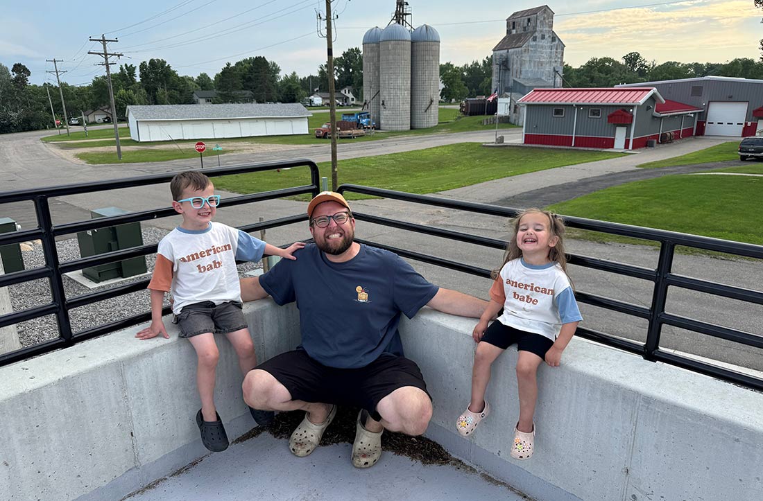 Cale Homuth and kids in rural town